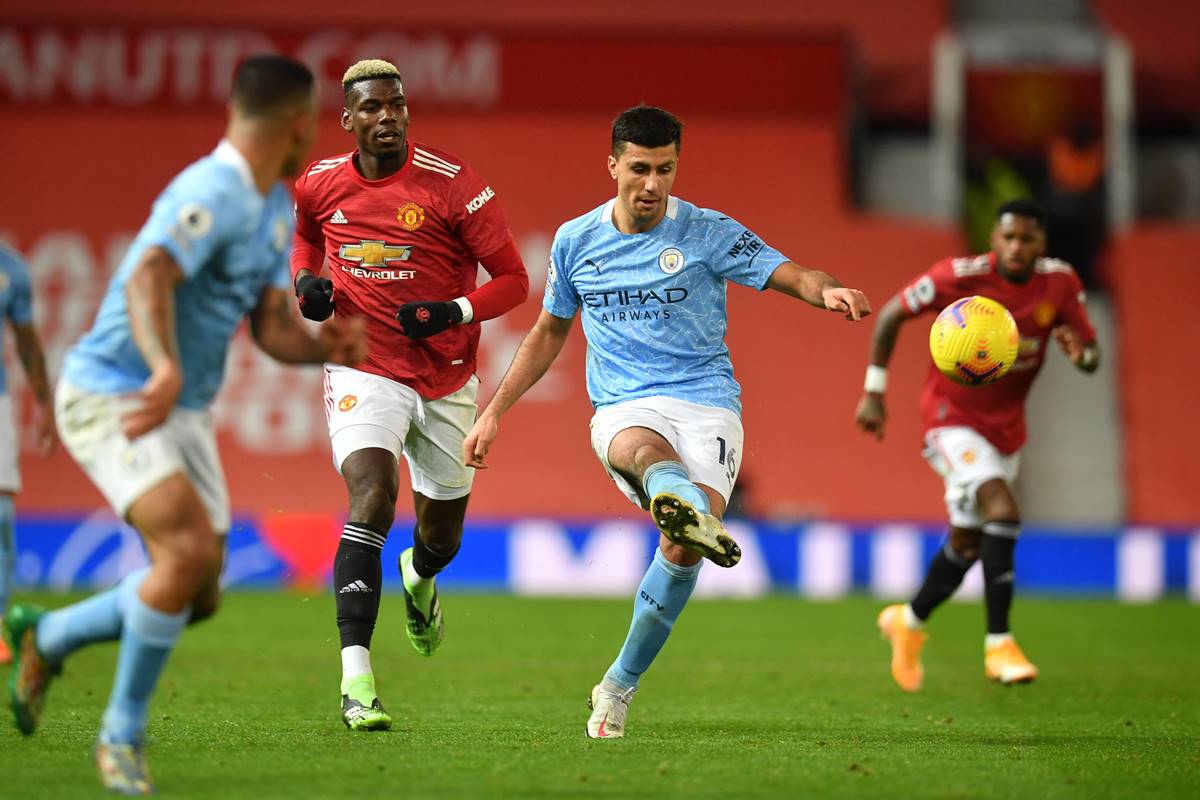 Manchester City's Rodrigo in action with Manchester United's Paul Pogba in Manchester United v Manchester City game at Old Trafford, Manchester. (Reuters image)