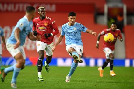 Manchester City's Rodrigo in action with Manchester United's Paul Pogba in Manchester United v Manchester City game at Old Trafford, Manchester. (Reuters image)
