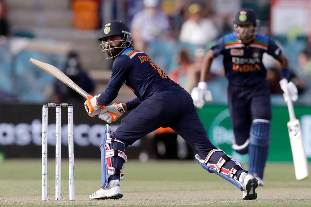 Ravindra Jadeja turns to watch the ball while batting with Hardik Pandya against Australia during their one day international cricket match at Manuka Oval in Canberra, Australia. (AP Photo)