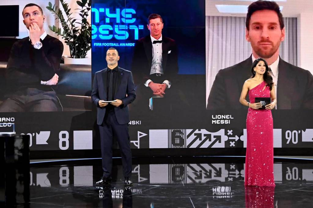 Robert Lewandowski is awarded The Best FIFA Men's Player as nominees Cristiano Ronaldo and Lionel Messi look on with Ruud Gullit and Reshmin Chowdhury (Reuters image)