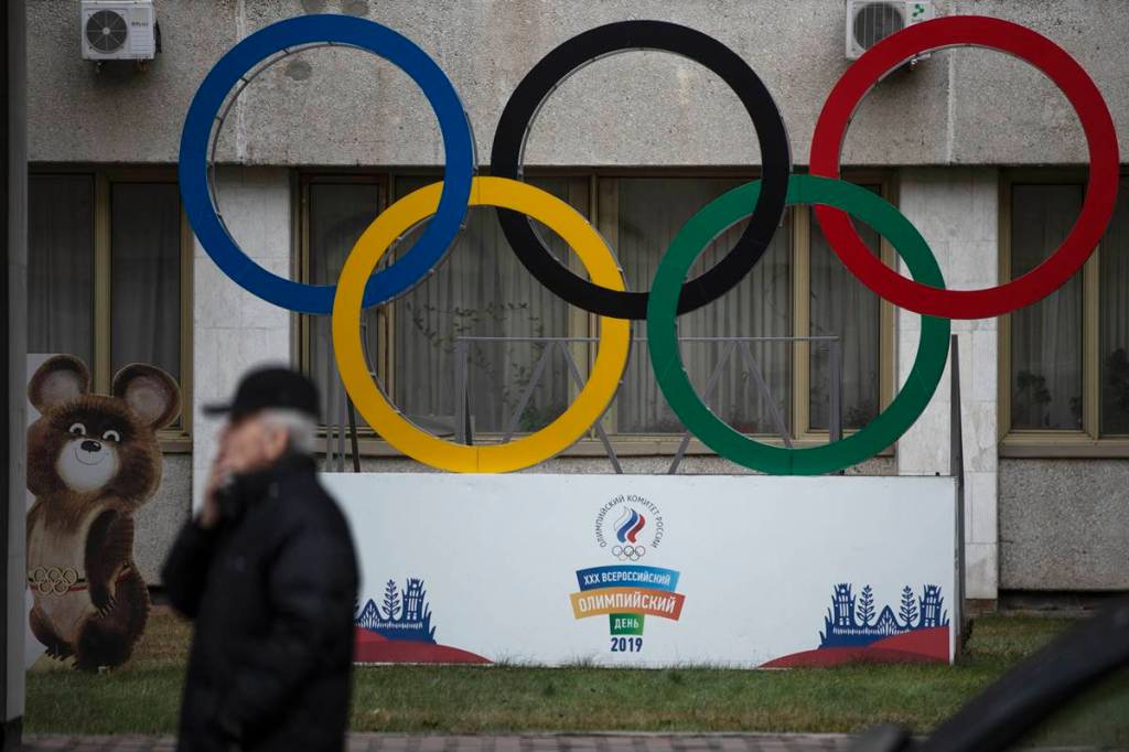 Olympic Rings and a model of Misha the Bear Cub, the mascot of the Moscow 1980 Olympic Games are seen in the yard of Russian Olympic Committee building in Moscow, Russia. (AP Photo/file) Olympic Rings and a model of Misha the Bear Cub, the mascot of the Moscow 1980 Olympic Games are seen in the yard of Russian Olympic Committee building in Moscow, Russia. (AP Photo/file)