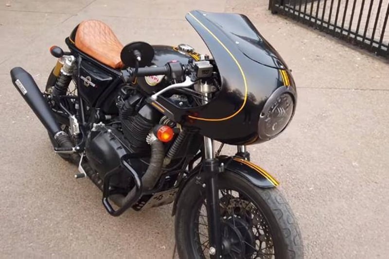 We came across this one just earlier this month. A custom-build Royal Enfield Interceptor 650 that's been transfomed to look quite convincingly like a Triumph Thruxton R with a semi-fairing and everything. It gets clip-on handlebars and the rear has been trimmed down. The bike has been finished in all black colour with contrasting yellow accents and pinstriping for the sporty cafe racer look.