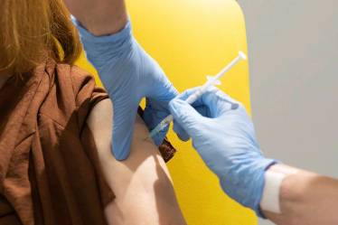 A volunteer is administered the coronavirus vaccine developed by AstraZeneca and Oxford University, in Oxford, England. (AP/File photo)