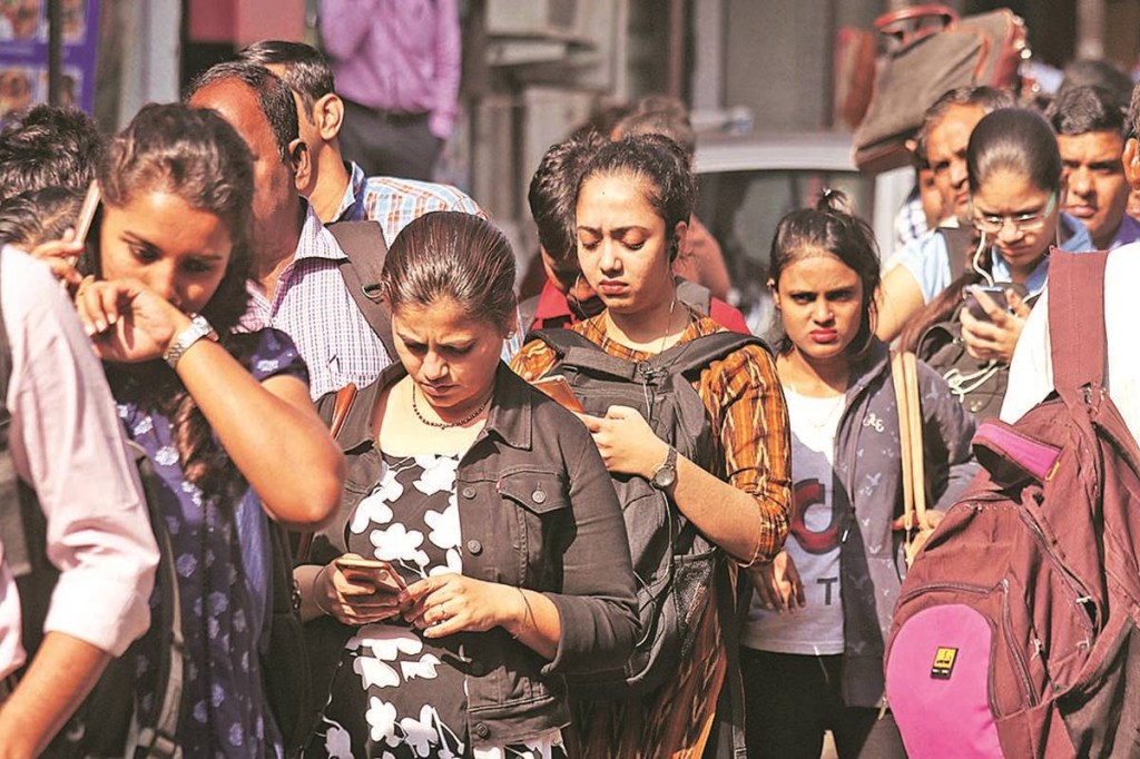 People stand in queue as they wait for taxis from Navi Mumbai to Mumbai during an indefinite strike by BEST employees, in Mumbai on Tuesday. Express Photo by Nirmal Harindran. 08.01.2019. Mumbai.