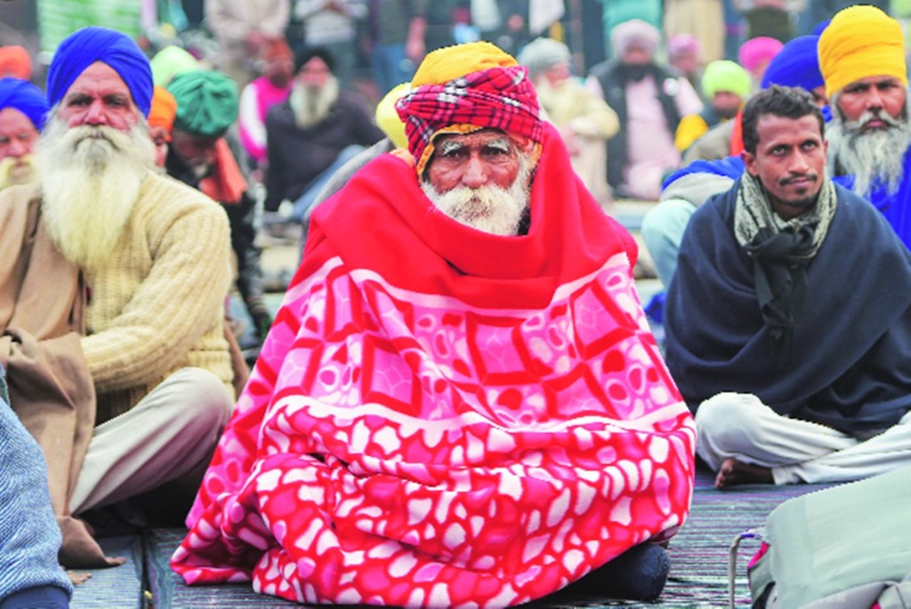Farmers during their ongoing protest against the new farm laws at Singhu Border in New Delhi (PTI Image) Farmers during their ongoing protest against the new farm laws at Singhu Border in New Delhi (PTI Image)