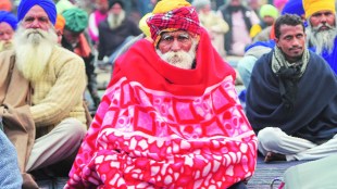 Farmers during their ongoing protest against the new farm laws at Singhu Border in New Delhi (PTI Image)