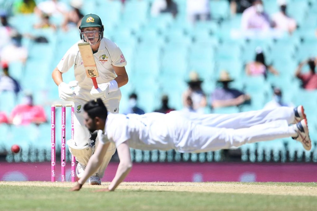 Australia v India 4th Test Marnus Labuschagne looks on as Mohammed Siraj of India dives for the ball
