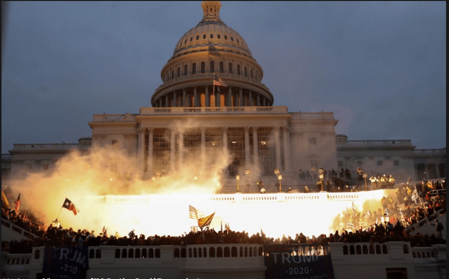 An explosion caused by a police munition is seen while supporters of US President Donald Trump gather in front of US Capitol Building in Washington. (Reuters)