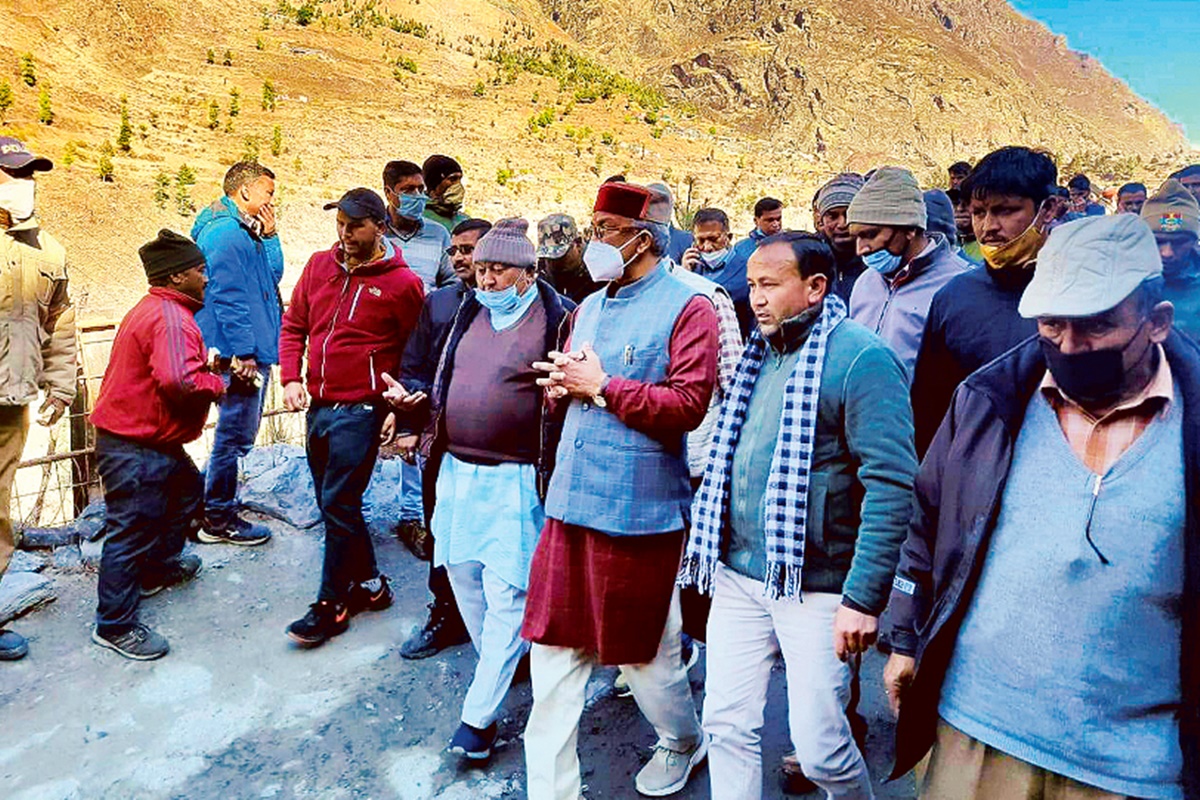 Uttarakhand chief minister Trivendra Singh Rawat (centre) inspects flood-hit areas, after a glacier broke off in Joshimath in Chamoli district, on Sunday (PTI image) Uttarakhand chief minister Trivendra Singh Rawat (centre) inspects flood-hit areas, after a glacier broke off in Joshimath in Chamoli district, on Sunday (PTI image)
