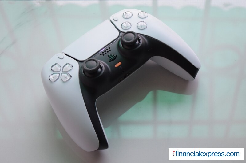The real star of the show is the 'new' wireless controller which is called DualSense now. It focuses on heightening the feeling of immersion by bringing a 'sense of touch' in games. This starts with updated 'haptic' feedback, something that replaces Sony's older-generation 'rumble' technology adding "a variety of powerful sensations you'll feel when you play." Even the shoulder (L2, R2) buttons have been updated with something that Sony calls 'adaptive' triggers "so you can truly feel the tension of your actions, like when drawing a bow to shoot an arrow." The controller, though it is familiar, is a little bigger than the outgoing DualShock 4. It has an integrated microphone (that you can also mute) and USB Type-C. (Photo credit: Saurabh Singh/Financial Express)