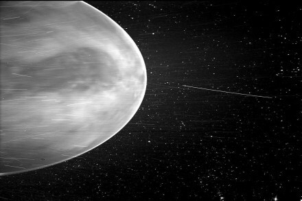 The dark feature prominently seen in the center of the image is called Aphrodite Terra, which is the largest highland region on the surface of Venus. 
 Image: NASA/Johns Hopkins APL/Naval Research Laboratory/Guillermo Stenborg and Brendan Gallagher