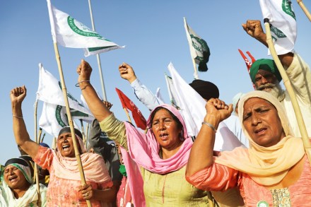 Farmers shout slogans and wave flags during the ongoing farmers' protest in Haryana (Reuters image)