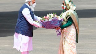 India Prime Minister Narendra Modi receives bouquet from Bangladesh PM Sheikh Hasina in Dhaka