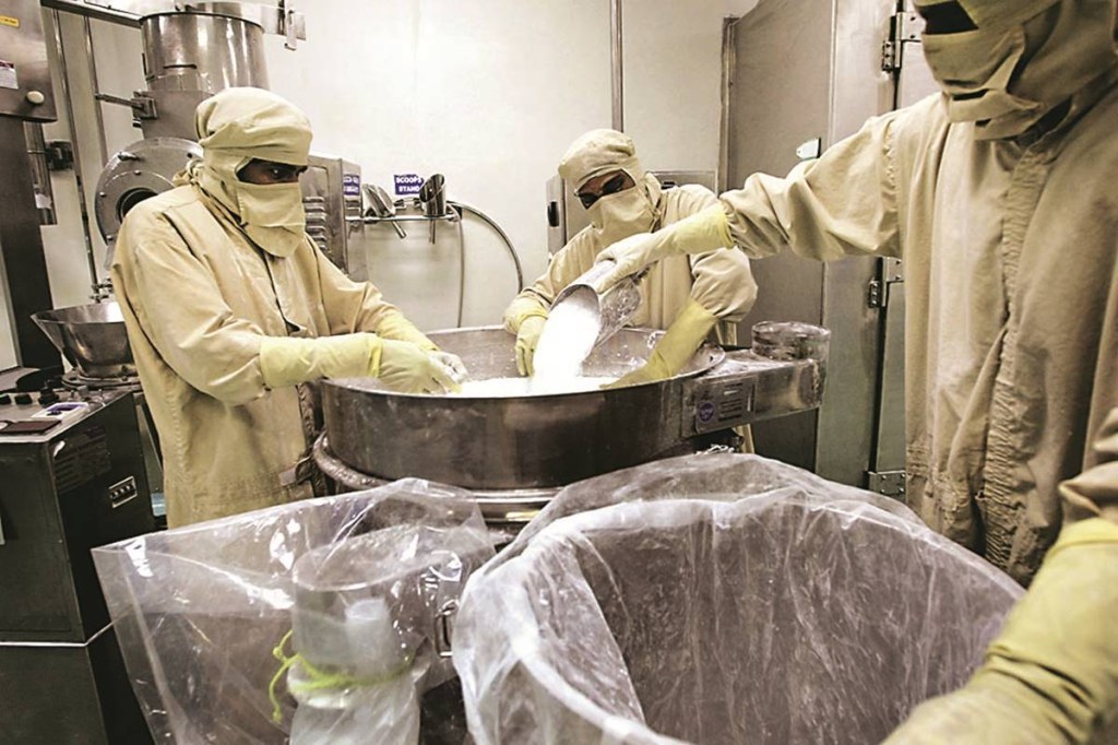 Workers pour in raw material to product medicine capsules at Dr Reddy's plant in Bachupally, Andra Pradesh state, India, Thursday, April 6, 2006. Ranbaxy Laboratories Ltd., India's largest drugmaker, and Dr. Reddy's Laboratories Ltd., the third biggest, say they plan to make acquisitions in the U.S. and Europe. Photographer: Amit Bhargava/Bloomberg News Workers pour in raw material to product medicine capsules at Dr Reddy's plant in Bachupally, Andra Pradesh state, India, Thursday, April 6, 2006. Ranbaxy Laboratories Ltd., India's largest drugmaker, and Dr. Reddy's Laboratories Ltd., the third biggest, say they plan to make acquisitions in the U.S. and Europe. Photographer: Amit Bhargava/Bloomberg News