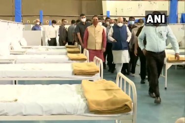 Shah and Rupani arrived at the Gujarat University Convention-cum-Exhibition Centre at GMDC Ground here, which is being turned into a COVID-19 treatment facility, with 900 oxygen beds, including 150 ICU ones, an official said.