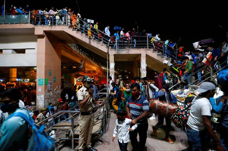 Delhi lockdown: Thousands of migrant workers head home despite CM ...