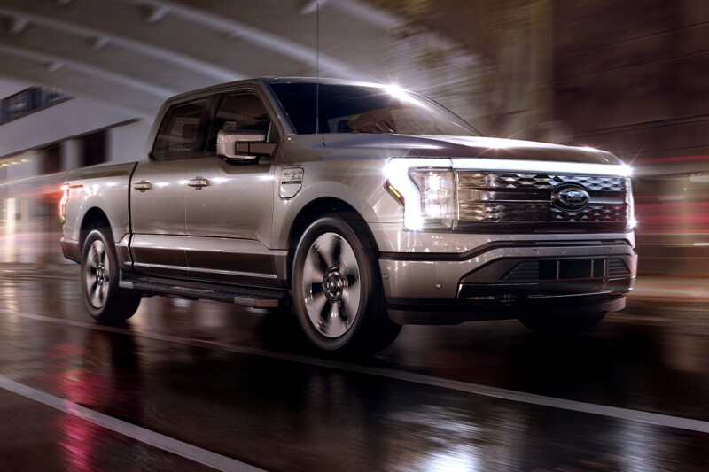Ford has finally taken the covers off of the all-electric vision of the best selling vehicle in America. Welcome, the Ford F-150 Lightning that is aimed squarely at Rivian R1T and Tesla Cybertruck. Ford has priced the F-150 Lightning at a jaw-dropping USD $41,699 (Rs 30.5 lakh) for the base model. At that price, Ford is trying to prove you don’t need to dump your life savings to buy an EV. The Lightning will go on sale in 2022.