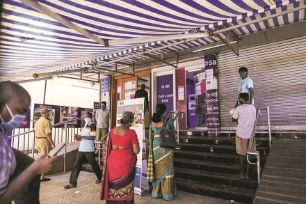 Customers wait in line at a State Bank of India (SBI) branch in Mumbai, India, on Monday, May 4, 2020. India's central bank Governor Shaktikanta Das and the chief executive officers of the nation's banks have discussed ways to ensure credit flow to businesses once the world's toughest stay-at-home order ends. Photographer: Dhiraj Singh/Bloomberg