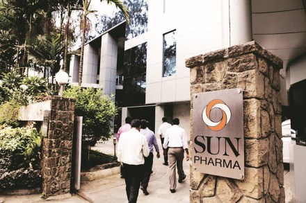 Employees enter the Sun Pharmaceutical Industries Ltd. corporate office in the Andheri suburb of Mumbai, India, on Monday, April 7, 2014. Sun Pharmaceutical, India's largest drugmaker by market value, agreed to buy Ranbaxy Laboratories Ltd. for $3.2 billion in stock, the biggest purchase by an Indian company in two years. Photographer: Amit Madheshiya/Bloomberg