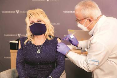 A file photo of Dolly Parton getting coronavirus vaccination @Dollyparton, via Reuters
