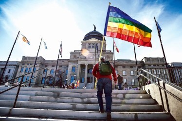 A file photo of LGBTQ+ demonstrators gathering on the steps of the Montana State Capitol in the US (AP)