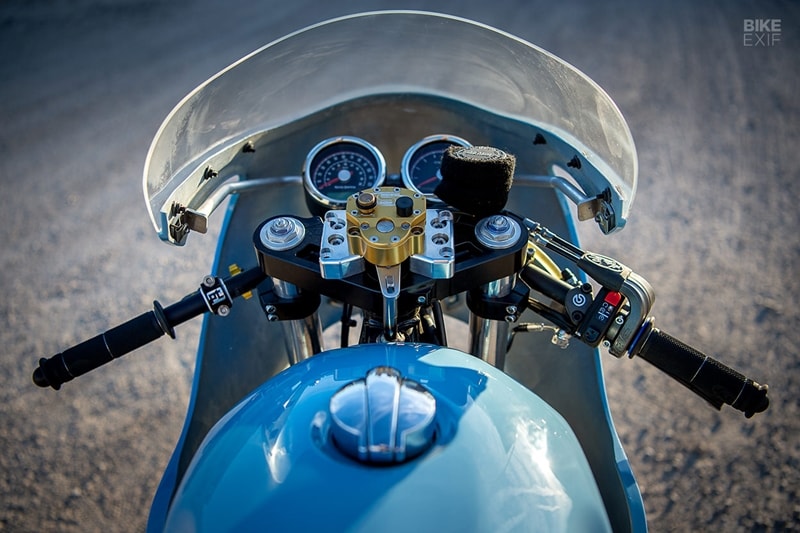 Trisha’s Royal Enfield gets a boost from an S&S high-flow air filter, with a Dynojet Power Commander V, quick-shifter and MotionPro Rev2 throttle all in play. It also has a MotionPro run/stop switch, a ProTaper clutch perch, and an Antigravity Lithium-ion battery to shave weight. Plugs Garage in Minnesota handled the paint. It’s a tribute to the Porsche 917 Gulf Oil racecar. (Source: Bikeexif)