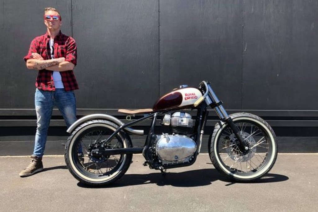 Custom Royal Enfield Interceptor 650 Bobber with unique exhaust swooping over rear wheel