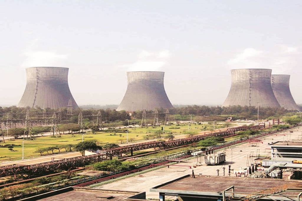 Cooling towers stand at the NTPC Ltd. power station in Dadri, India, on Friday, March 12, 2010. NTPC Ltd. plans to start a coal-fired unit at its Dadri plant in three months, General Manager of Dadri Plant S.N. Ganguly said Friday. Photographer: Pankaj Nangia/Bloomberg