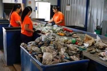 A file photo of workers separating different types of plastic at a plant in Portugal (REUTERS)