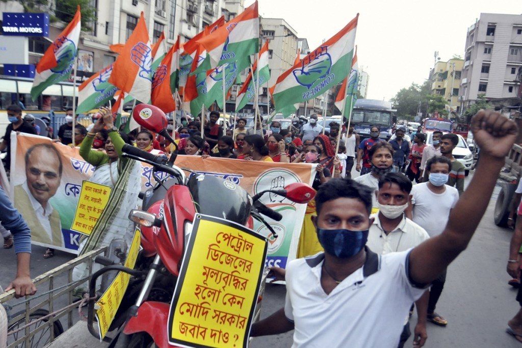 Congress activists in a protest rally against the hike in LPG and fuel prices in Kolkata (PTI Image) Congress activists in a protest rally against the hike in LPG and fuel prices in Kolkata (PTI Image)