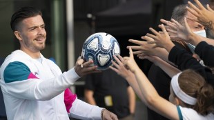 Manchester City's new signing Jack Grealish hands a football to supporters (PTI IMage)