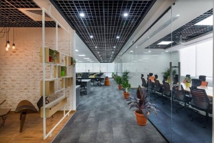 Large companies check into flexible co-working spaces to cut costs
