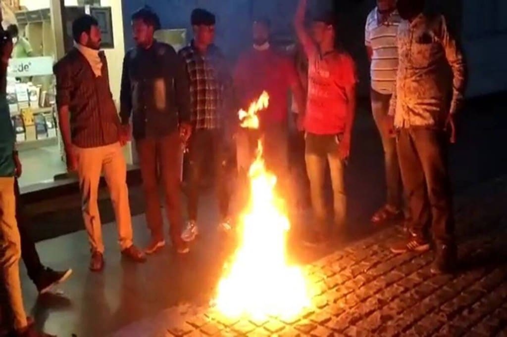 The Bajrang Dal workers burnt the book outside an Ahmedabad store, alleging that it had an “objectionable depiction” of Lord Krishna. (Express Photo)