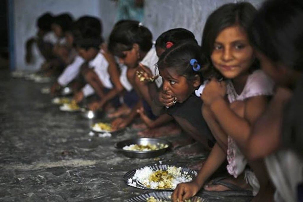 The scheme would cover about 11.8 crore children studying in 11.20 lakh schools across the country. During FY21, the Centre spent more than Rs 24,400 crore in the scheme, including cost of about Rs 11,500 crore on foodgrains. (Representative image) The scheme would cover about 11.8 crore children studying in 11.20 lakh schools across the country. During FY21, the Centre spent more than Rs 24,400 crore in the scheme, including cost of about Rs 11,500 crore on foodgrains. (Representative image)
