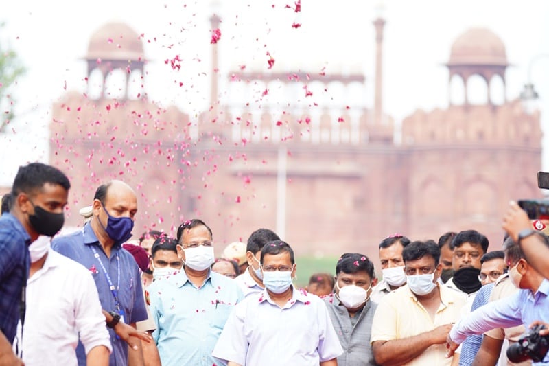 Delhi CM Arvind Kejriwal, accompanied by Minister Satyendar Jain, walks on the Chandni Chowk stretch ahead of his inaugural address. (Image: Arvind Kejriwal Twitter)