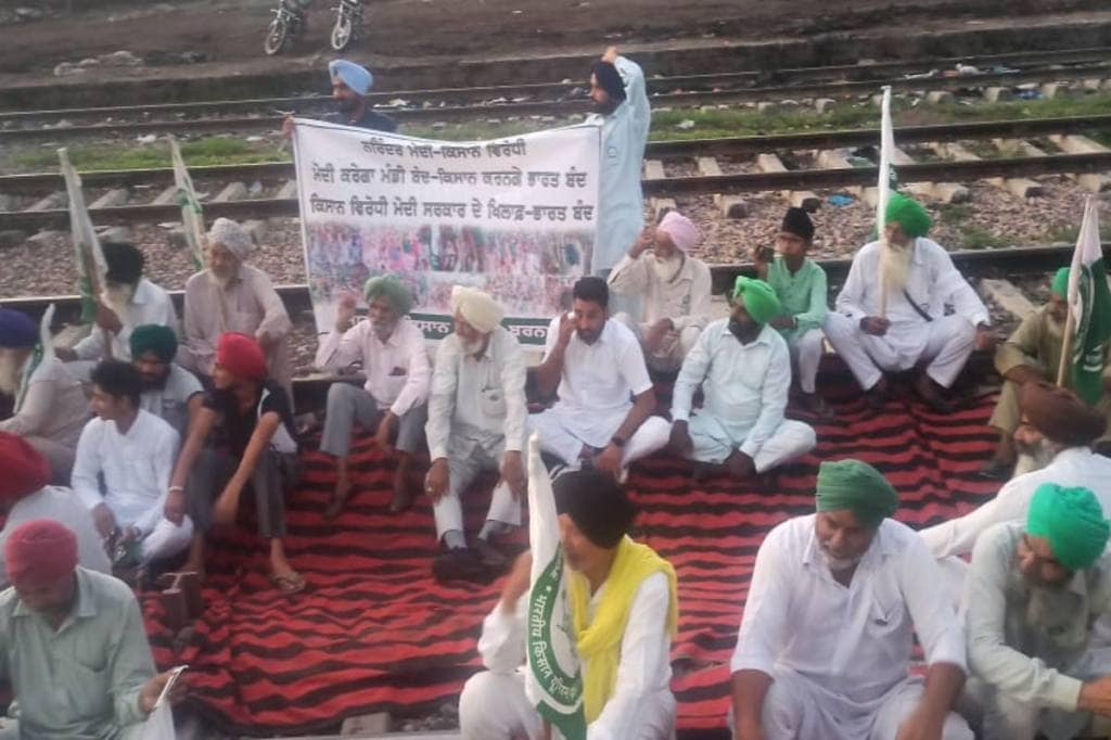 Bharat Bandh: Protesters sitting on railway tracks in Barnala (Express Photo)