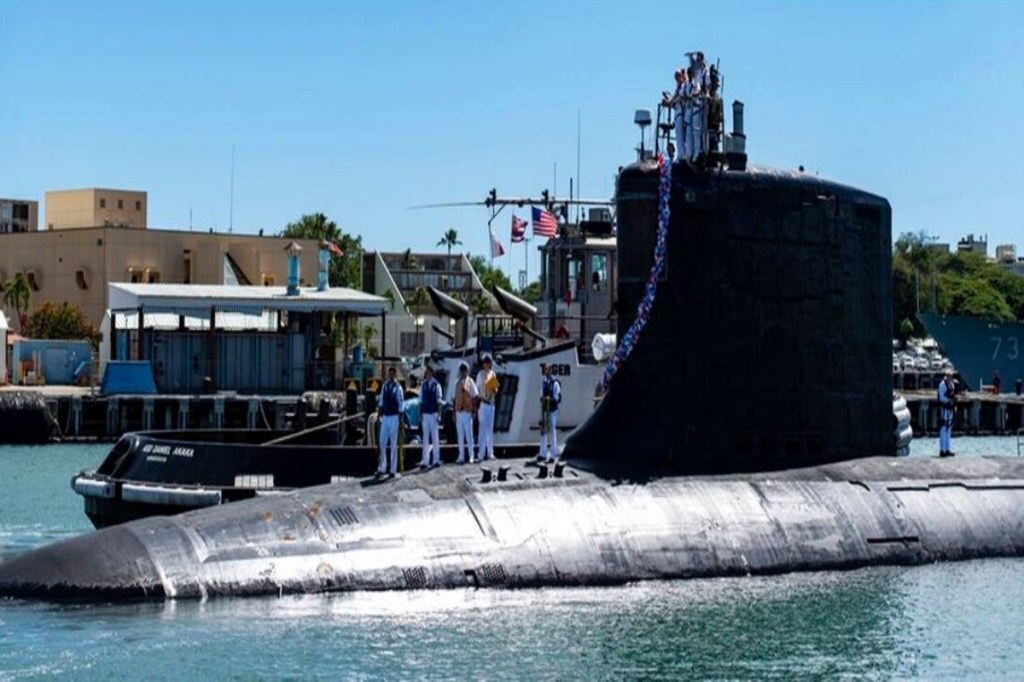 n this photo provided by U.S. Navy, the Virginia-class fast-attack submarine USS Illinois (SSN 786) returns home to Joint Base Pearl Harbor-Hickam from a deployment in the 7th Fleet area of responsibility on Sept. 13, 2021. (AP Photo)