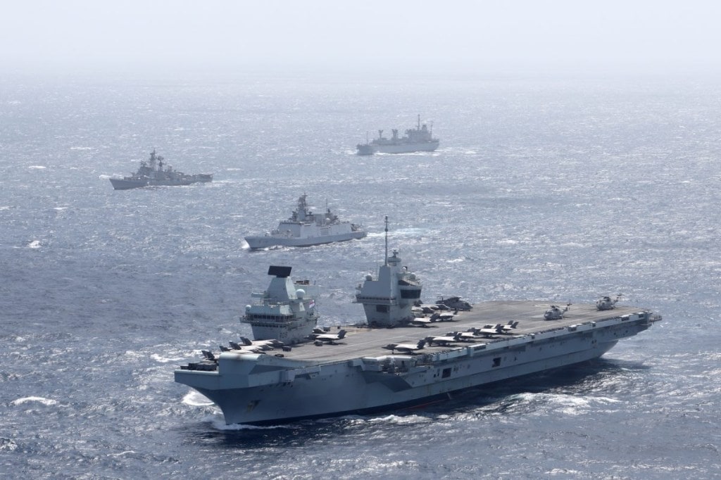 HMS Queen Elizabeth (front) with an Indian Shivalik Multi-role Frigate (second from front) in the Bay of Bengal. (Image: Royal Navy)