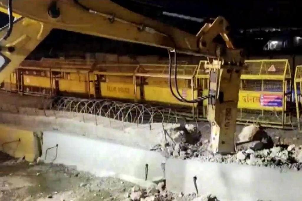 So far, four layers of the barricades at the Tikri border have been removed.