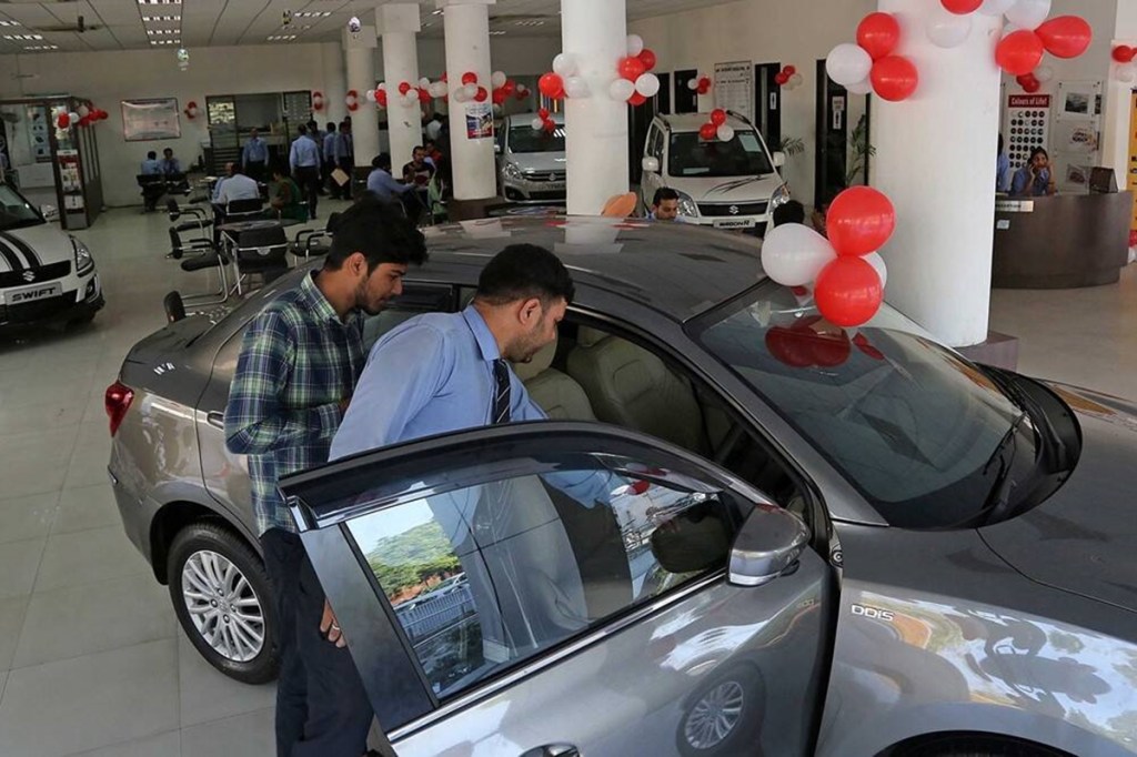 A customer looks at a car at a Maruti Suzuki dealership (Image for representational purposes only)