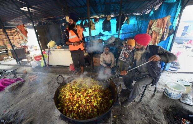 A farmer prepares 'langar' at Singhu border to mark the one-year anniversary of farmers' agitation, in New Delhi (PTI Image)