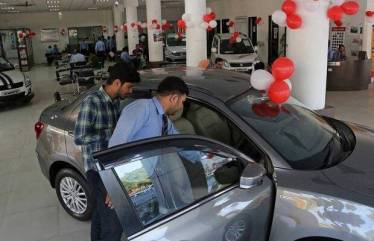 A customer looks at a car at a Maruti Suzuki dealership (Image for representational purposes only)