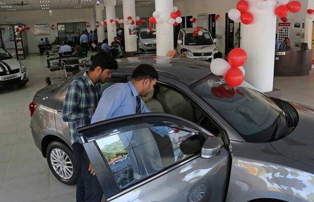 A customer looks at a car at a Maruti Suzuki dealership (Image for representational purposes only)