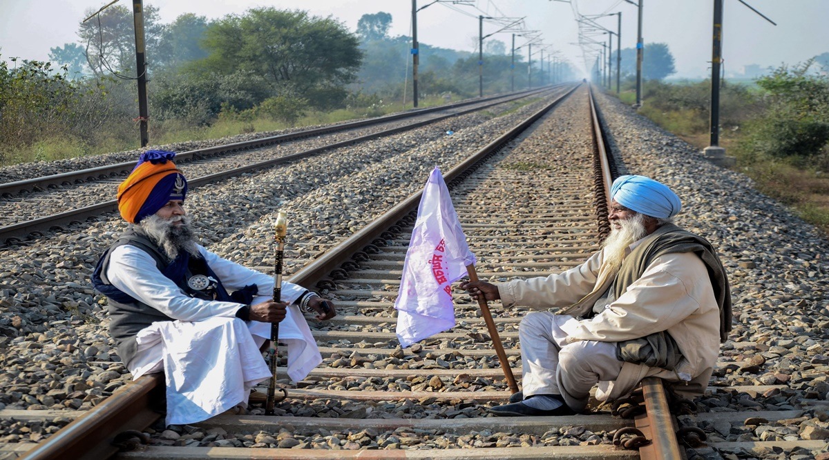 Farmers under the leadership of Kisan Mazdoor Sangharsh Committee block a railway track of Amritsar-Delhi railway line to protest against the state government for their various demands, including waiver of total debt of farmers and labourers, and compensation for the damage to paddy crops, at Devi Dass Pura village, near Amritsar (PTI Image)