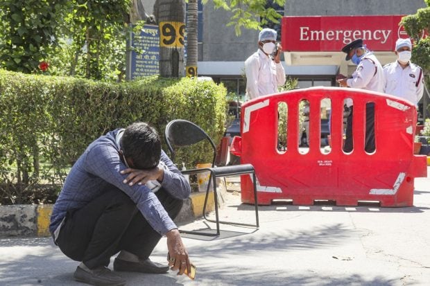 A man breaks down after loosing his relative at Jaipur Golden hospital, Rohini, New Delhi on April 24, 2021. Atleast 20 critically COVID 19 patients died amid oxygen scarcity in this hospital. (PTI Photo)