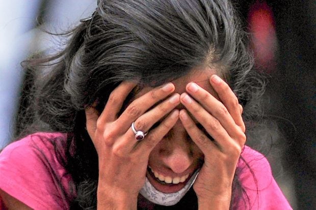 A family member of a victim reacts after a fire at a Covid-19 hospital where at least 13 people died, in Virar on April 23, 2021. (PTI Photo)