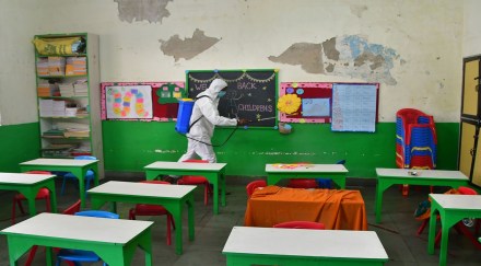A worker sanitises a classroom at a school ahead of its reopening in Mumbai (Image: PTI) A worker sanitises a classroom at a school ahead of its reopening in Mumbai (Image: PTI)