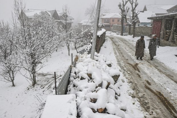 Kashmir received fresh snowfall, forcing suspension of air traffic to the valley as authorities carried out snow-clearance operations in all major towns. (PTI Photo)