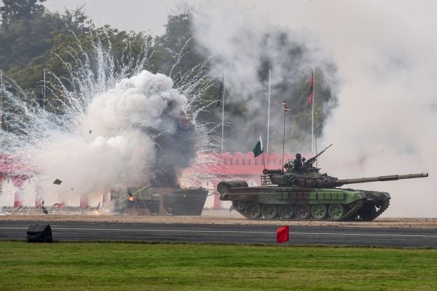Army jawans display their war skills during the full dress rehearsal for the Army Day Parade, at Army Parade Ground in New Delhi. (PTI Photo)