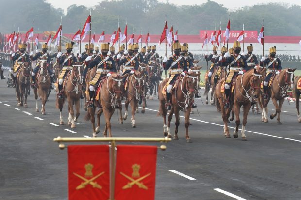 Army Guards contingent marches past during the full dress rehearsal for the Army Day Parade, at Army Parade Ground in New Delhi. (PTI Photo)